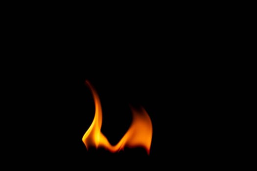 Hot flames on a black background. Beautiful flame of fire in the dark. Abstract of burning flames and smoke.