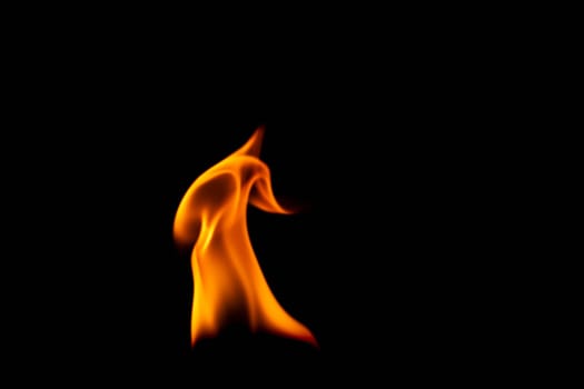 Hot flames on a black background. Beautiful flame of fire in the dark. Abstract of burning flames and smoke.