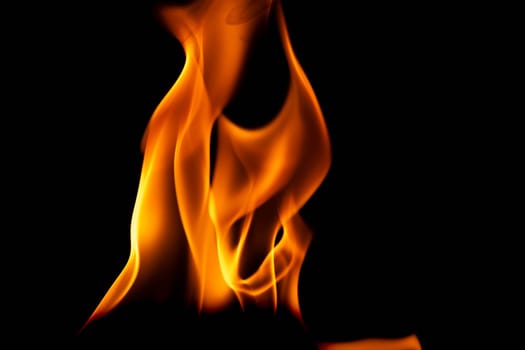 Hot flames on a black background. Beautiful flame of fire in the dark. Abstract of burning flames and smoke.