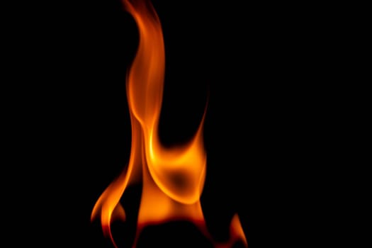 Hot flames on a black background. Beautiful flame of fire in the dark. Abstract of burning flames and smoke.