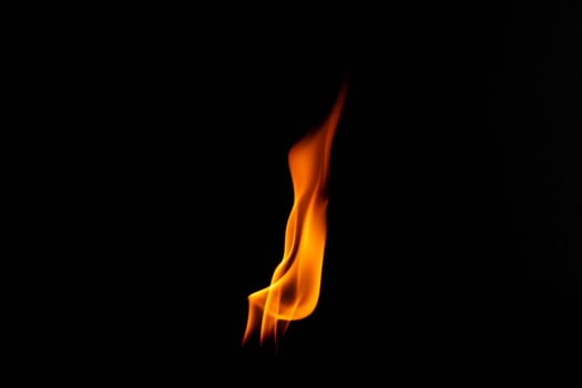 Hot flames on a black background. Beautiful flame of fire in the dark. Abstract of burning flames and smoke.