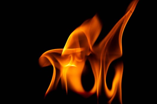 Hot flames on a black background. Beautiful flame of fire in the dark. Abstract of burning flames and smoke.