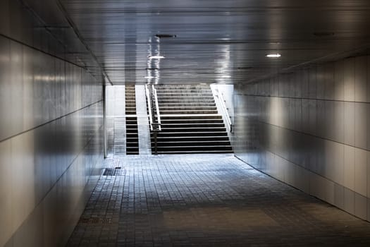 Exit the tunnel underpass and stairs in sunlight