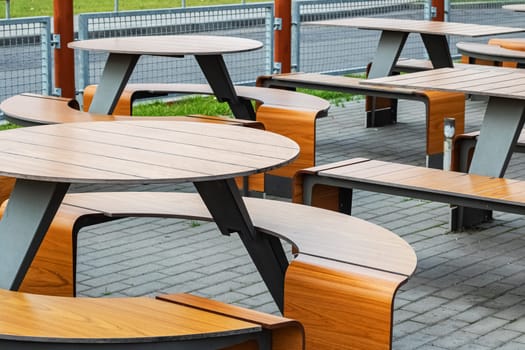 Wooden tables and chairs in a cafe outdoor close up