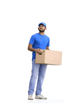 A male deliveryman, on a white background, full-length, with a box.