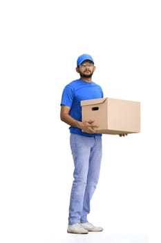 A male deliveryman, on a white background, full-length, with a box.