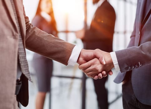 Nice to meet you. Close-up of two young businessmen shaking hands