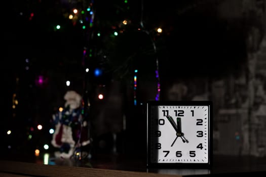 Clock on the background of New Year's fir, copy space