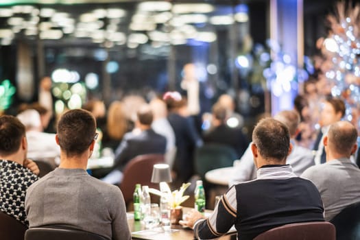 Rear view of unrecognizable people at banquet business meeting event. Business and entrepreneurship events concept.