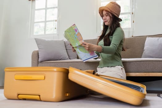 Woman packing a suitcase for a new travel trip. bag and luggage for journey.