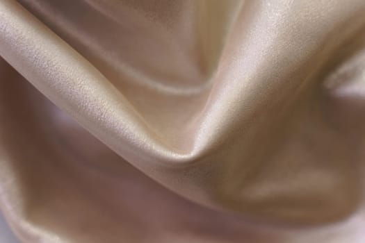 Beautiful smooth elegant light brown satin silk fabric texture. Abstract background