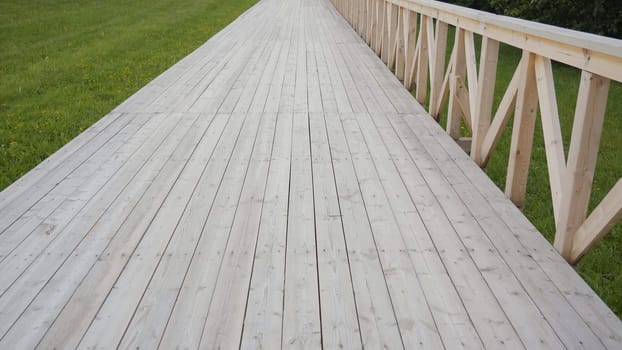 Outdoor wooden walkway. Video in motion
