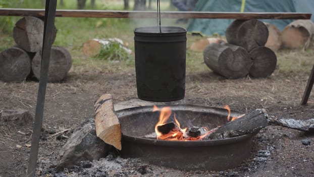 Campfire with black pots on the hike