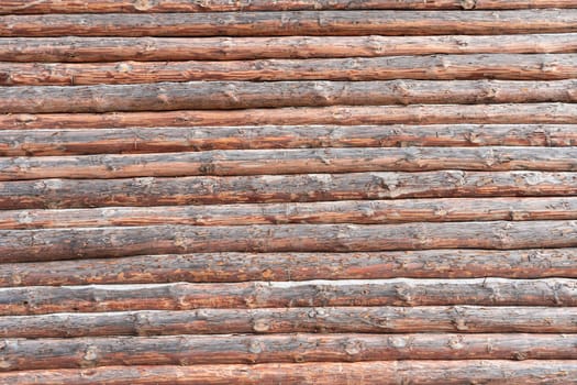 House wall in the village. Russian masonry of logs in the southern Urals