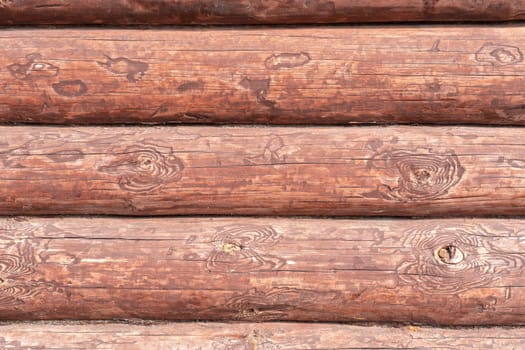 House wall in the village. Russian masonry of logs in the southern Urals