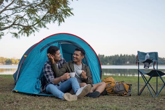 Happy Asian male gay couple on camping together in a forest. romantic vocation trip. lgbt concept.