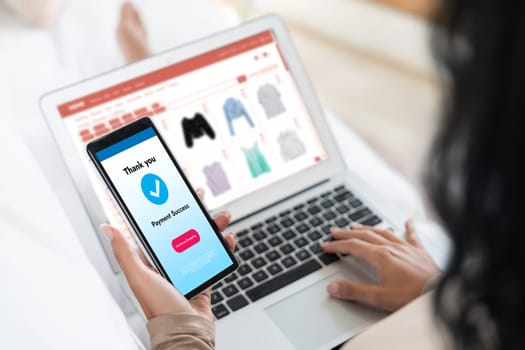 Woman shopping online on internet marketplace browsing for sale items for modern lifestyle and use credit card for online payment from wallet protected by crucial cyber security software