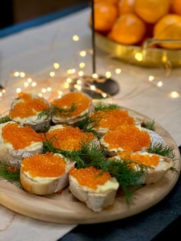 Festive candlelight dinner with shrimp and caviar sandwiches. High quality photo