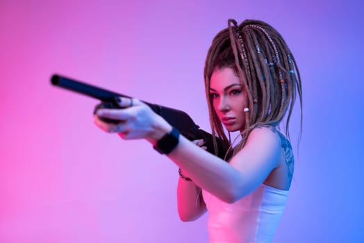 a cheeky girl with braided dreadlocks on her head in neon light with an gun in neon light