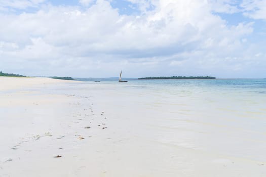 wooden boat moored near the shore at sunny day, summer concept, copy-space, Zanzibar beach, Tanzania.