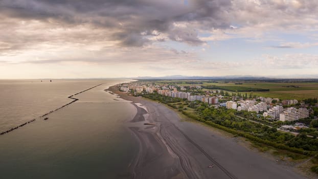 Drone view of sandy beach at sunrise, Summer vacation concept.Lido Adriano town,Adriatic coast, Emilia Romagna,Italy.