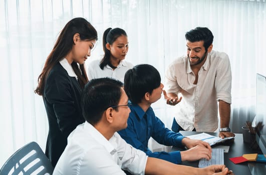 Group of diverse office worker employee working together on strategic business marketing planning in corporate office room. Positive teamwork in business workplace concept. Prudent