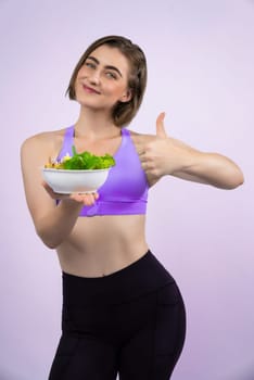 Full body length gaiety shot athletic and sporty young woman with healthy vegan food in standing posture on isolated background. Healthy active and body care by vegetarian lifestyle.