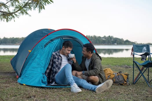 Happy Asian male gay couple on camping together in a forest. romantic vocation trip. lgbt concept.