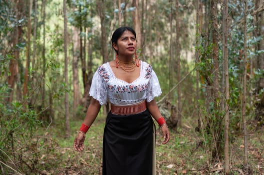 indigenous girl from ecuador with typical dress from otavalo walking through a forest with an excited face enjoying the emotional health that nature gives her. earth day. High quality photo
