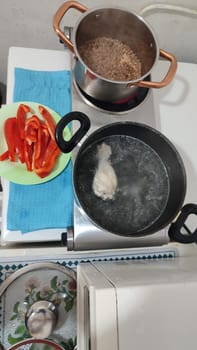 fresh cut red bell pepper, salad food pan in the kitchen vegetarianism. High quality photo