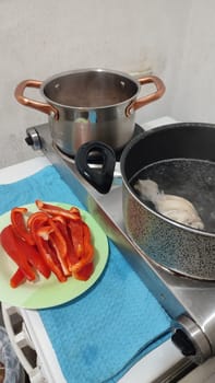 fresh cut red bell pepper, salad food pan in the kitchen vegetarianism. High quality photo