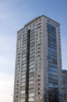 Belarus, Minsk - 24 march, 2023: Tall modern house at sunset close up