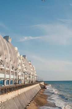 coastal area with apartment buildings of residential areas, modern hotel and restaurant complex on water and sandy beaches