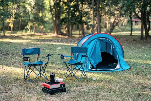 tent and camping in forest, dinner and adventure on nature background. camping background concept.