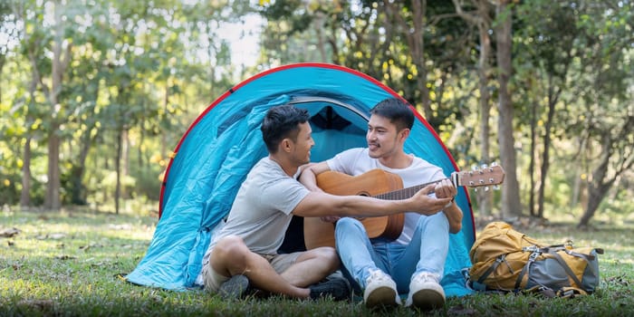 Male gay couple asian traveling with tent camping outdoor and various adventure lifestyle hiking active summer vacation.