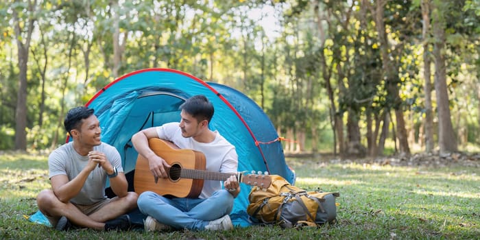 Male gay couple asian traveling with tent camping outdoor and various adventure lifestyle hiking active summer vacation.