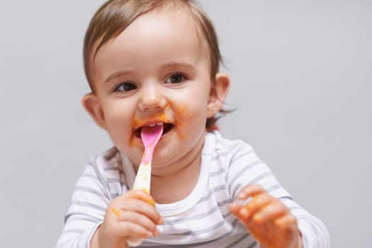 Eating, cute and boy baby in chair with vegetable food for child development at home. Sweet, nutrition and hungry young kid or toddler enjoying healthy lunch, dinner or supper meal at house