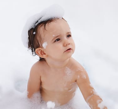 Baby, hygiene and foam for washing in bathroom, bath and cleaning for skincare at home. Girl, toddler and childcare or water for prevention of bacteria and virus, cosmetics and shampoo or soap.