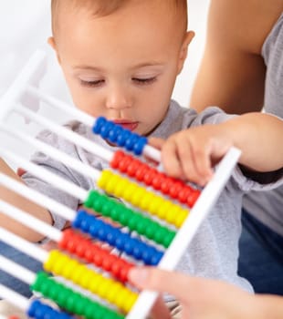 Abacus, math and baby with mom playing, learning and teaching for child development on bed. Bonding, toy and closeup of mother teaching kid, infant or toddler with counting in bedroom at home