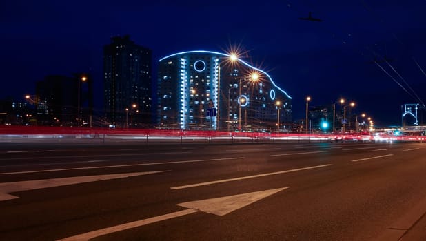 Landscape of the city of Minsk in Belarus blurred lights of car headlamps in the motion of the window lighting in the evening