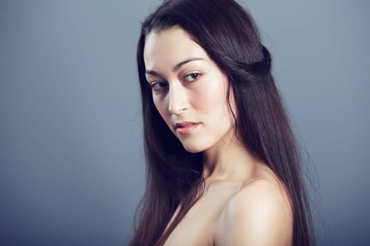 Natural beauty, cosmetic care and woman with hair in studio, hairstyle and shine on dark background. Portrait, makeup glow on skin with dermatology, haircare and texture with growth and shine.