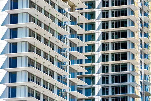 New highrise residential building under construction. Background image