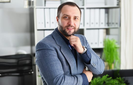 portrait of young handsome promising businessman work in office like his job