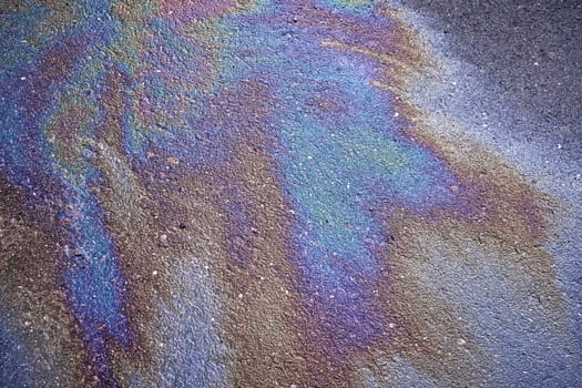 Gas Puddle on Parking Lot Dividing Line Close Up Abstract.