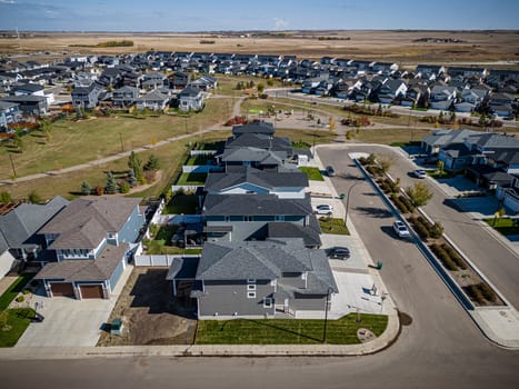 Drone shot over Willowgrove, Saskatoon, highlighting its residential beauty, modern streets, and vibrant community spaces.