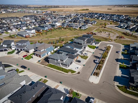 Drone shot over Willowgrove, Saskatoon, highlighting its residential beauty, modern streets, and vibrant community spaces.