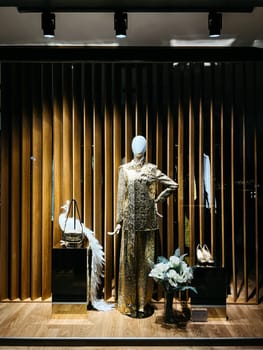 Classic women evening suit in a shop window. High quality photo