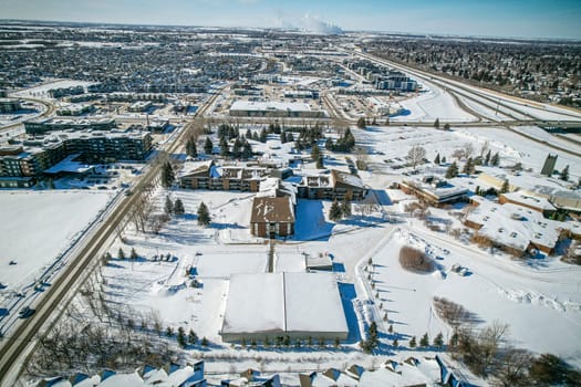 Captivating drone image of Stonebridge, Saskatoon, highlighting its harmonious blend of modern homes, parks, and amenities.
