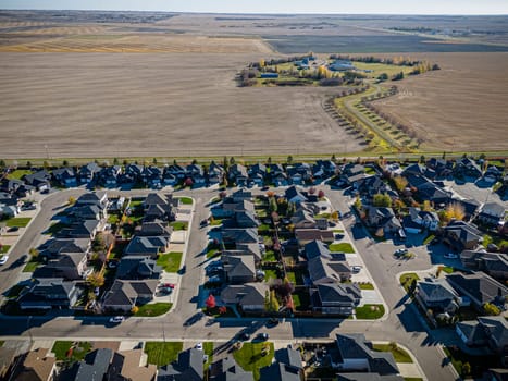 Drone shot over Willowgrove, Saskatoon, highlighting its residential beauty, modern streets, and vibrant community spaces.