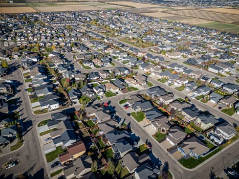 Drone shot over Willowgrove, Saskatoon, highlighting its residential beauty, modern streets, and vibrant community spaces.